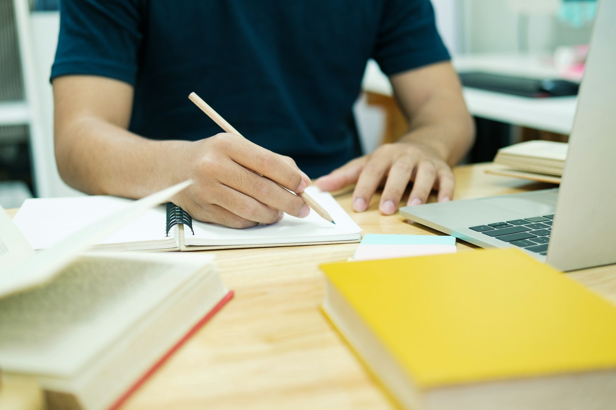 Young male student study at home.